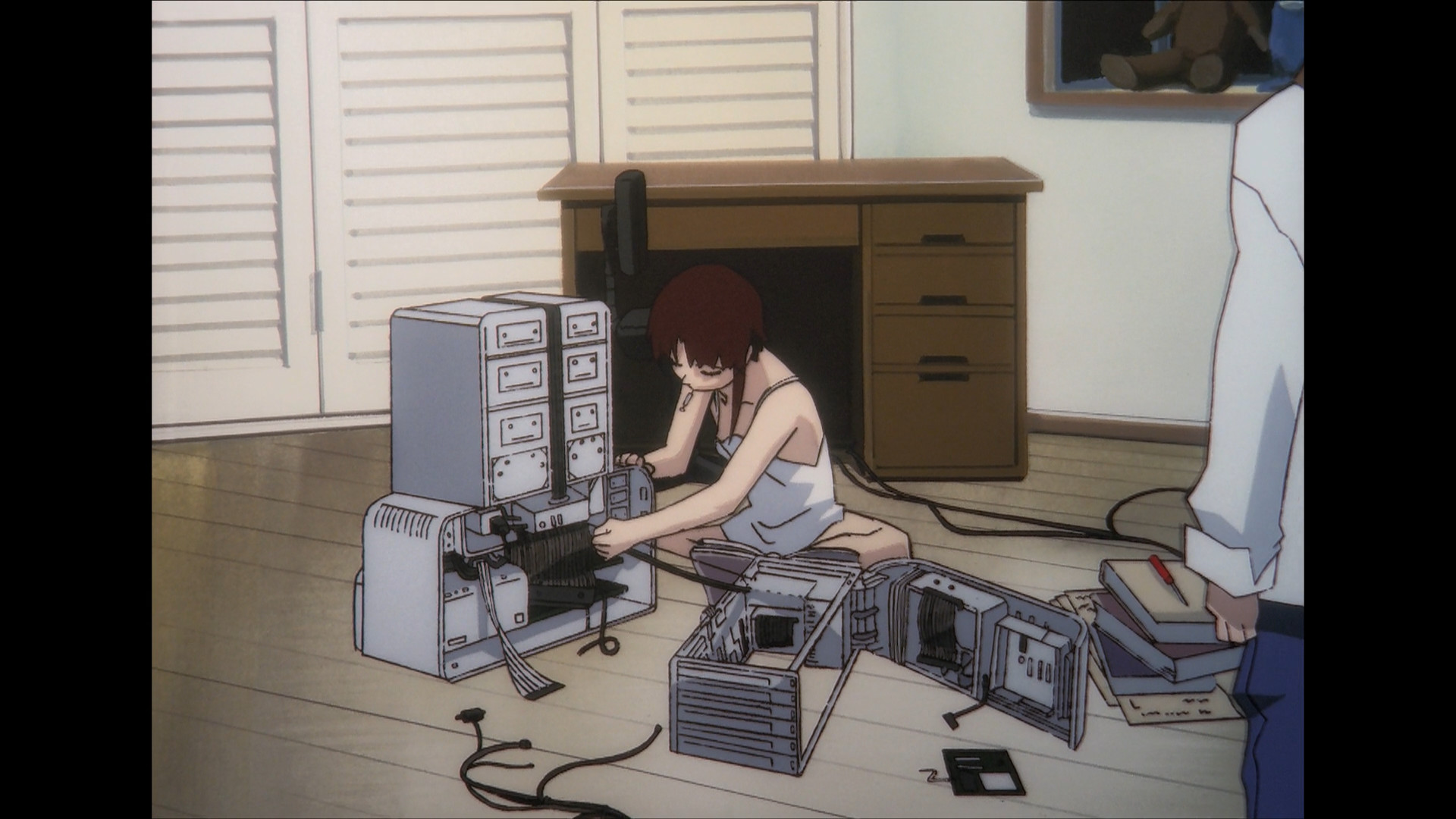Lain tinkering with her NAVI (basically a computer)
