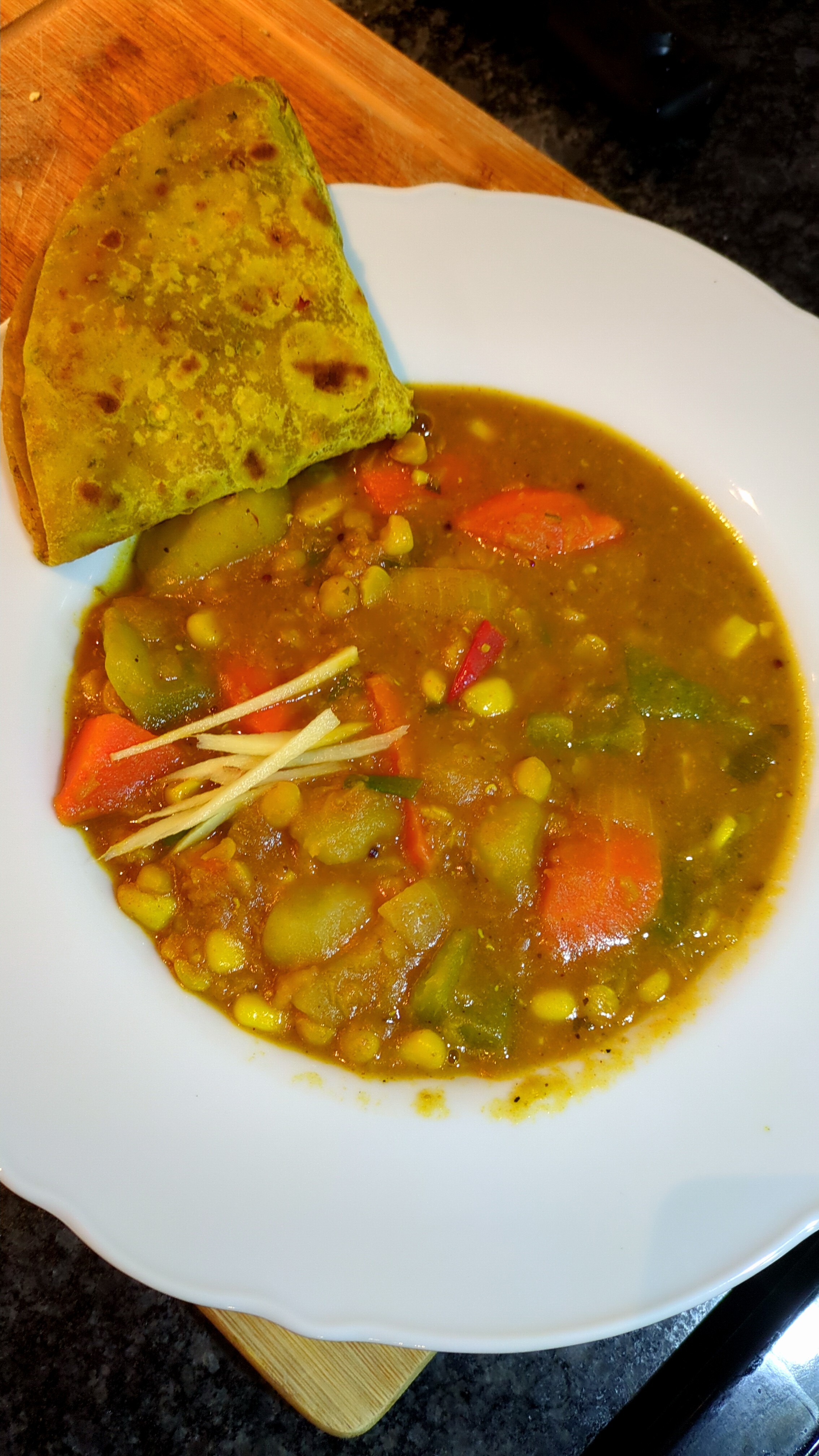 an image of a daal fry dish, with poor lighting making the food look unappetizing.