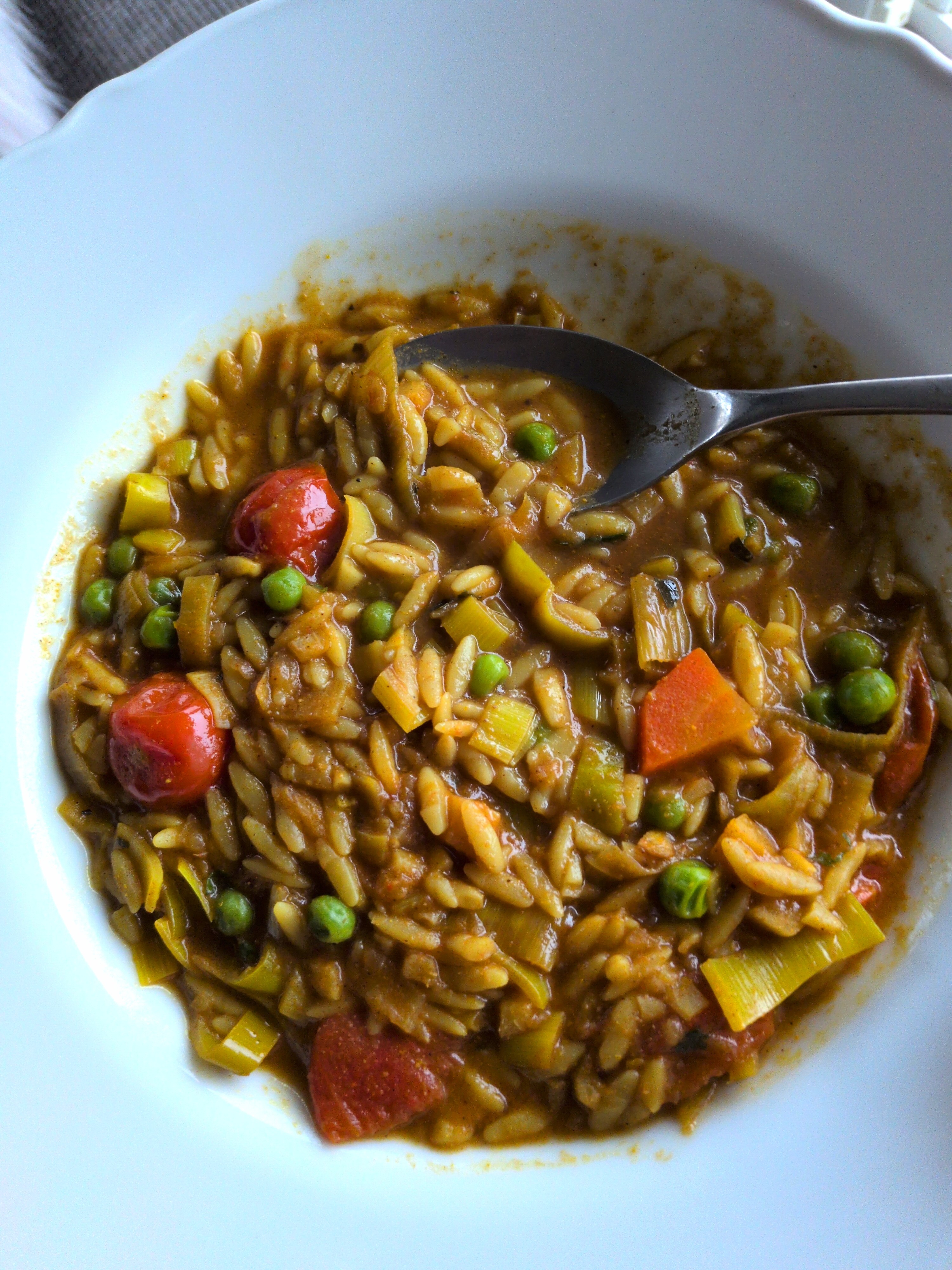 a dish of Sambar Soup with orzo added