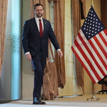 Vance arriving for a news conference. The camera captures him in walking motion, in an awkward freeze frame of differing proportions of extension in his legs and arms.