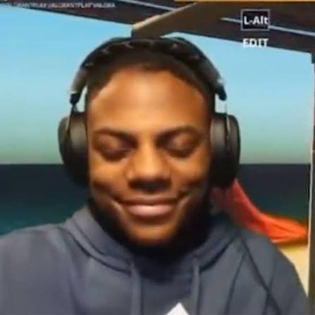alt: popular reaction image of streamer "ishowspeed" trying not to laugh