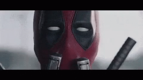 animated GIF of Deadpool live action scene where he sniffs his guns and says "I'm touching myself tonight."