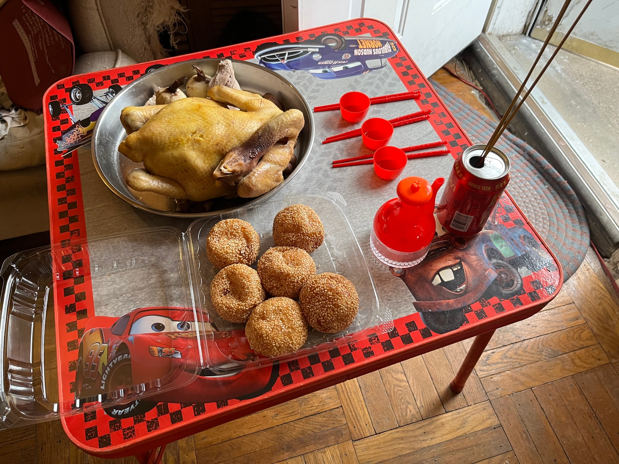A table full of stuff that parents do... I guess like "prayers"(?) for lunar new year that's hard for me to describe since idk what these are anyways...