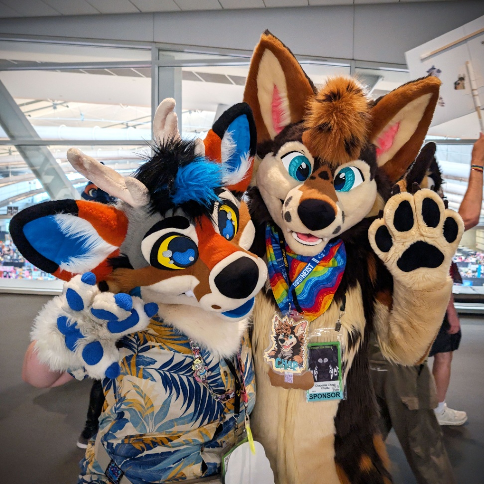 Two fursuit posing for the photo. 