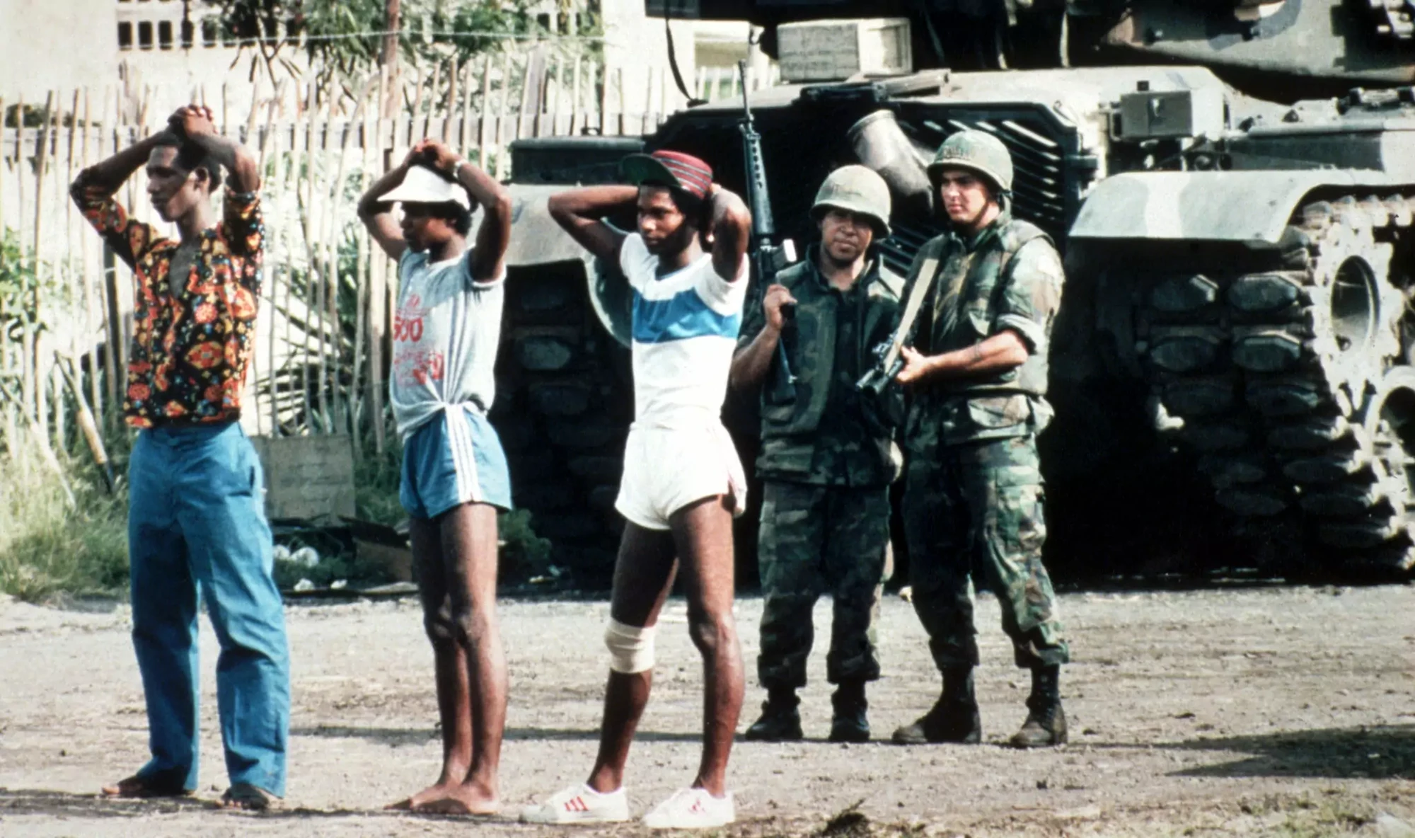 US soldiers stand guard over Grenadian prisoners in St George’s, Grenada, 1983. Photograph: AP
