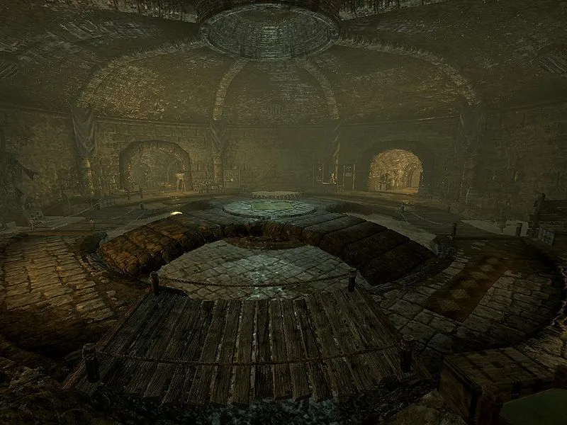 A large chamber within a sewer system, taken from the "Cistern" location in Skyrim.